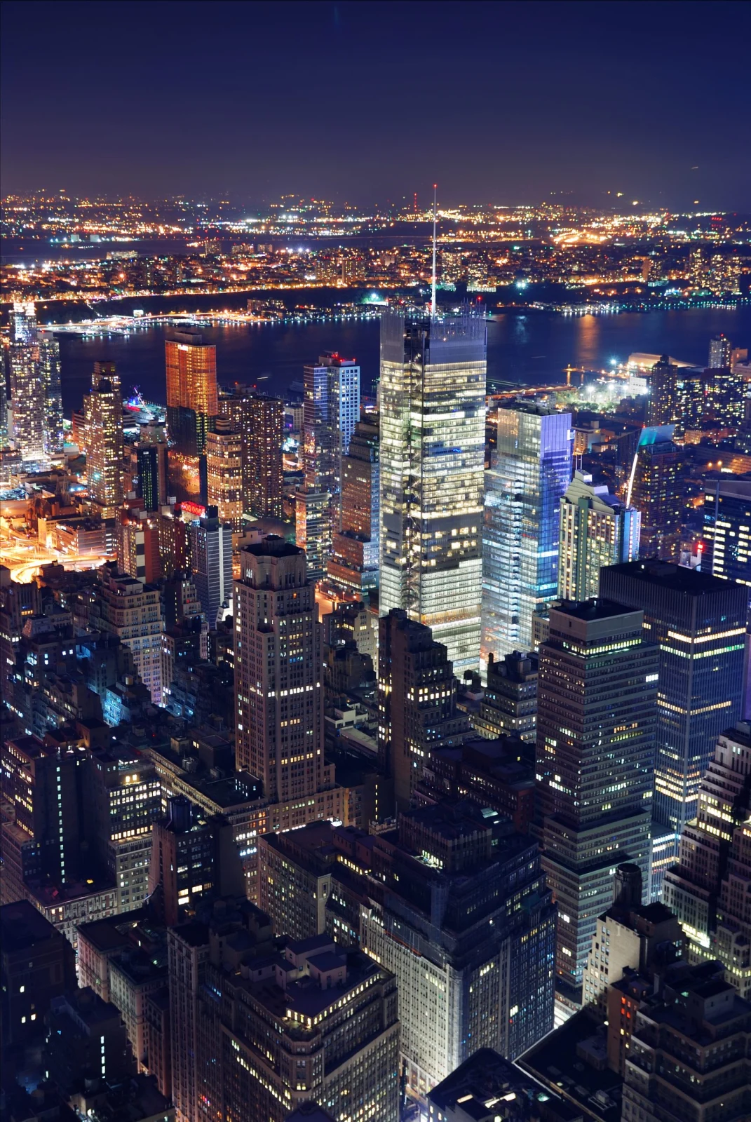 New York City Car Service — Manhattan skyline at night, luxury chauffeured black car